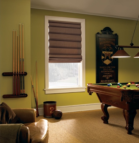Roman shades in Gainesville game room with green walls.